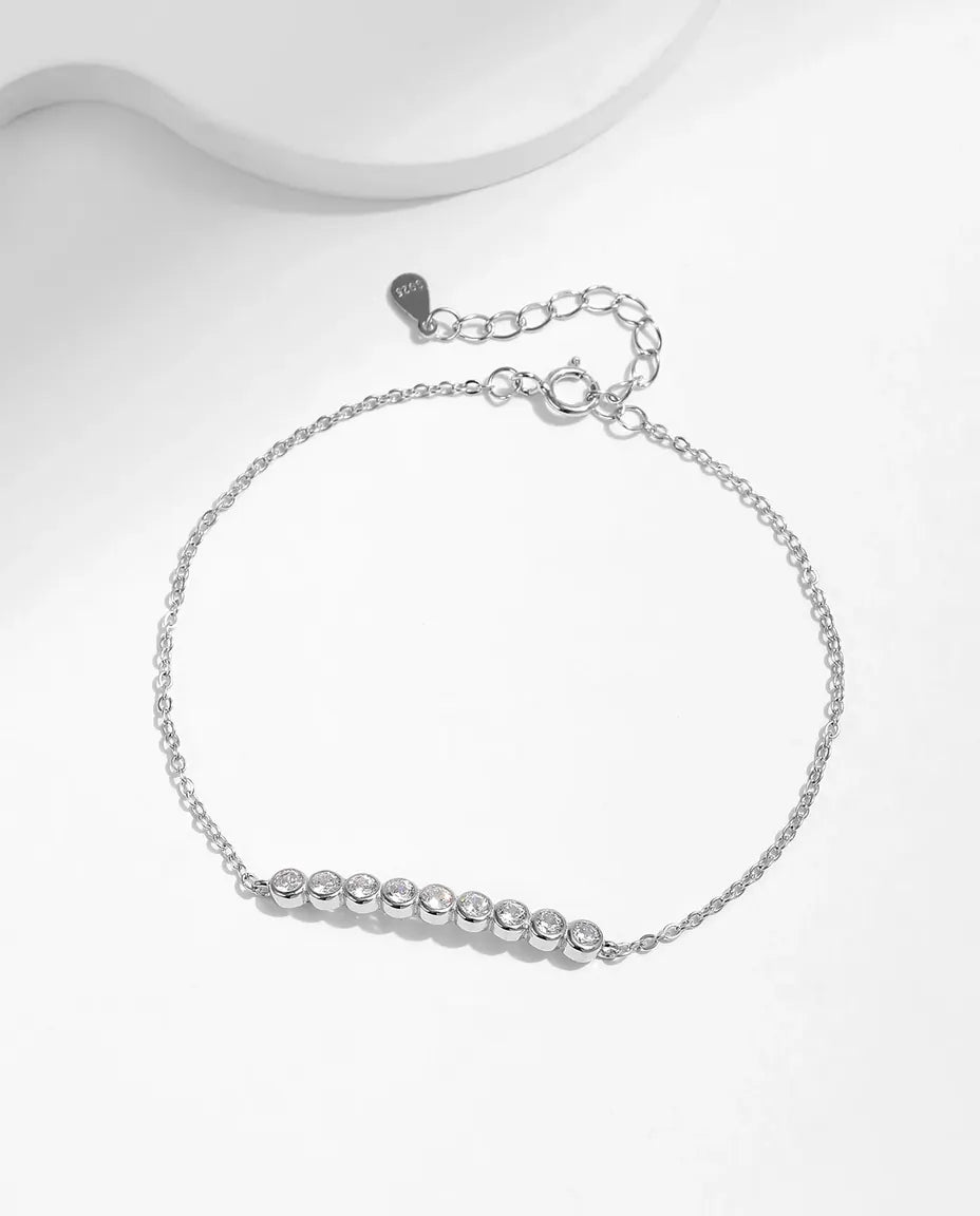 Dainty moissanite station bracelet, 9 round D color stones, 925 sterling silver