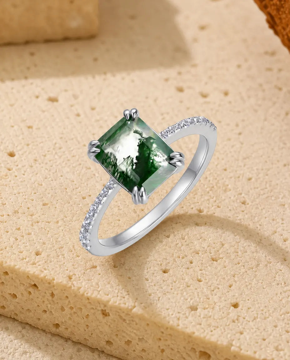 Emerald-cut moss agate pave solitaire ring in sterling silver with double-claw prongs and pave band