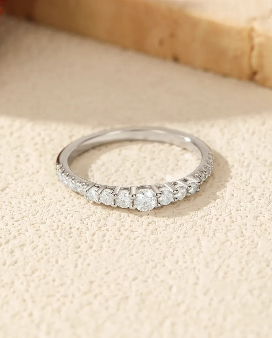 Graduated moissanite wedding band in 925 sterling silver with 19 round D color stones