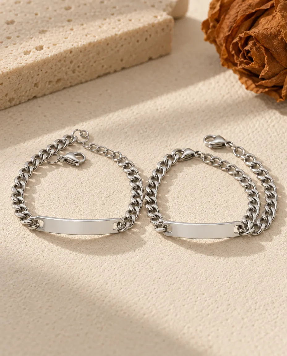 Bar Engraved Couple Bracelets - matching pair laid flat