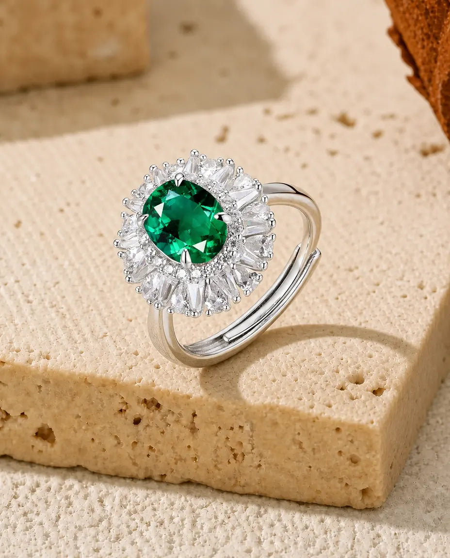 Lab emerald oval halo adjustable ring in sterling silver with radiating baguette halo