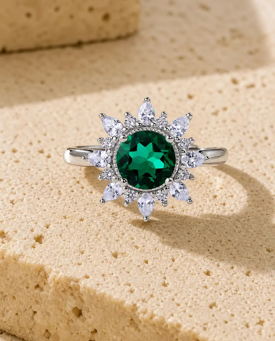 Lab emerald sunflower halo adjustable ring in sterling silver with marquise petals