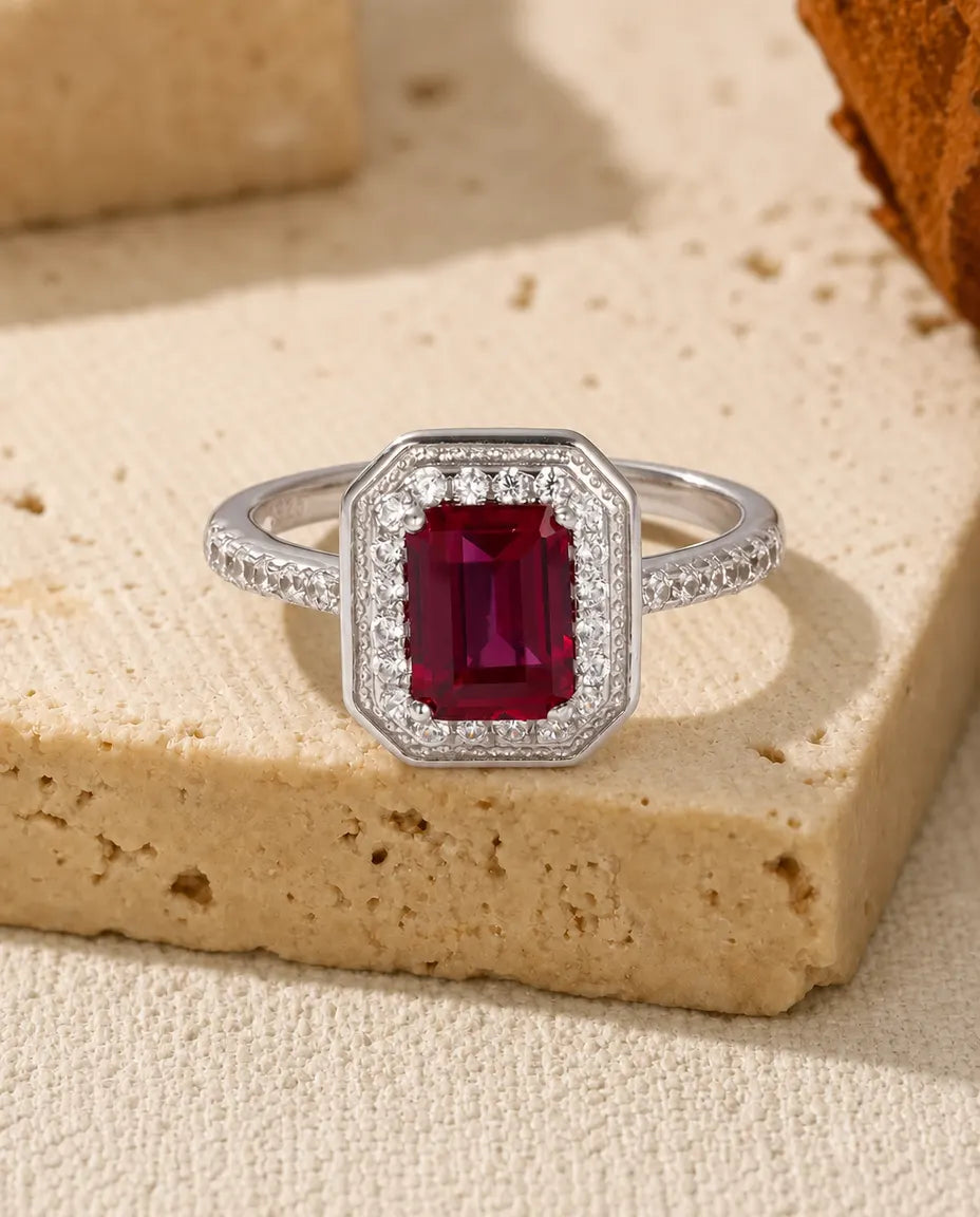 Lab ruby octagon halo ring in sterling silver with milgrain frame and pave band