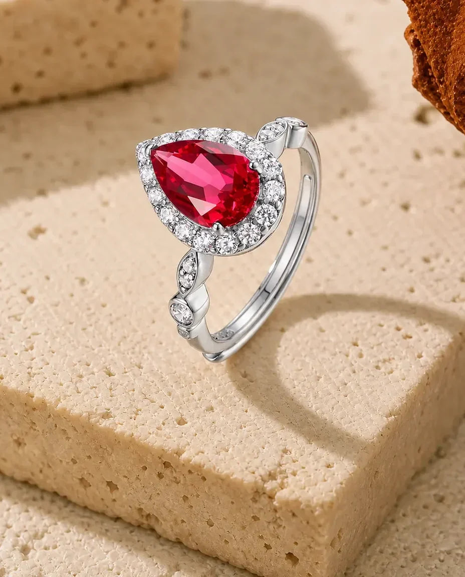 Lab ruby pear halo adjustable ring in sterling silver with vintage marquise and bezel band