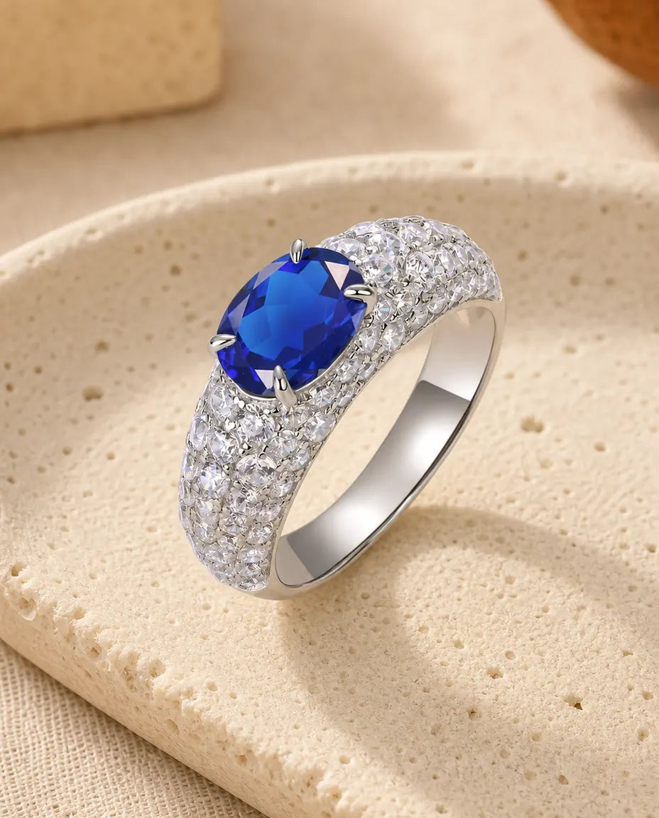 Lab sapphire east west oval pave statement ring in sterling silver with domed band
