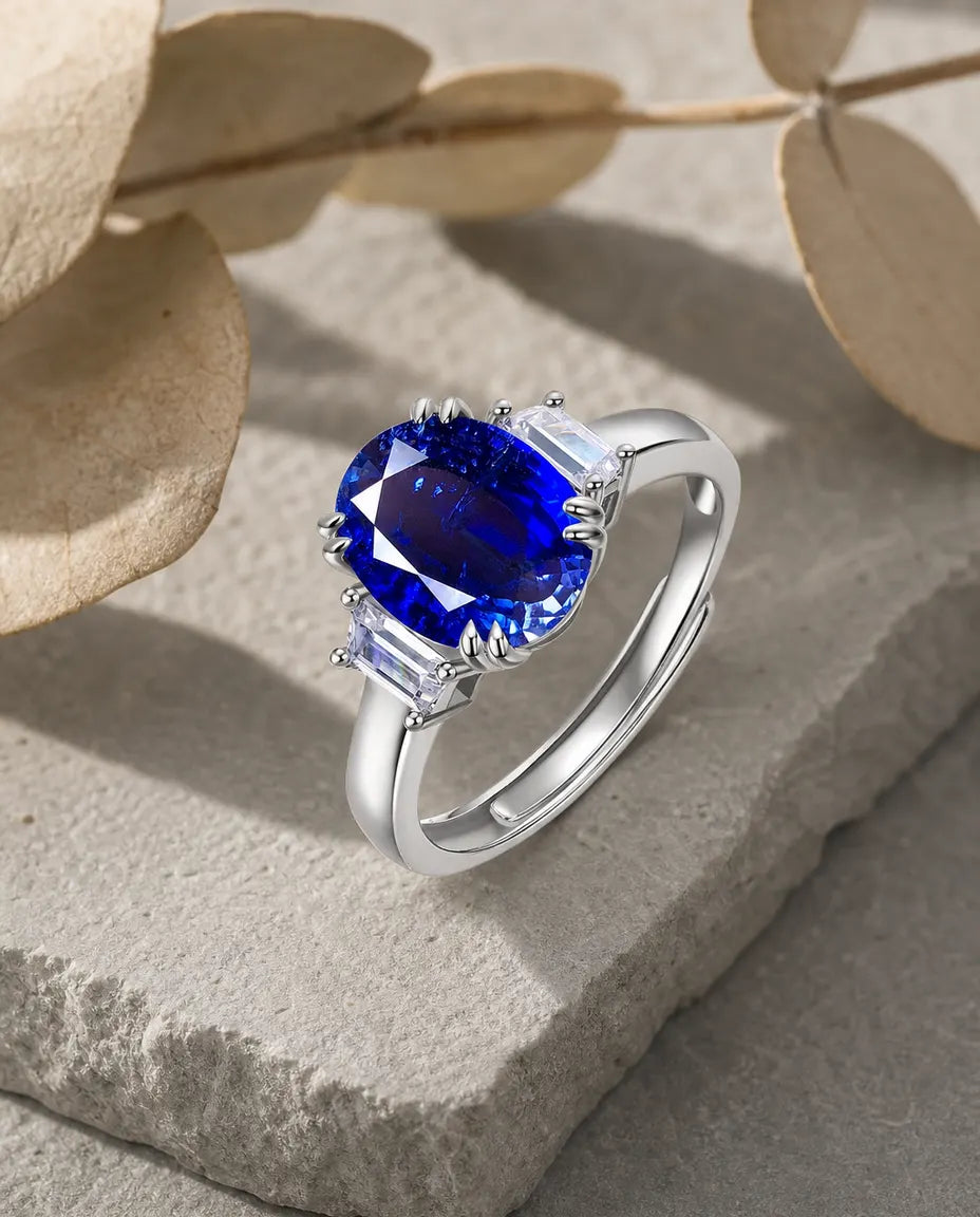 Lab sapphire oval three stone adjustable ring in sterling silver with baguette CZ sides