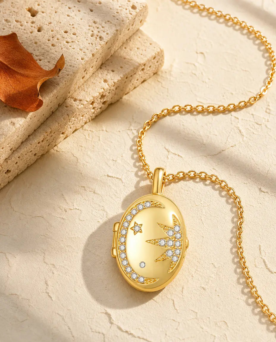 Personalized moon and star oval photo locket necklace holding two pictures, gold