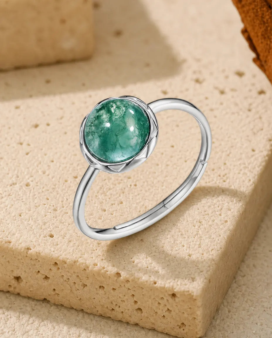 Moss agate round cabochon adjustable ring in sterling silver with sunburst bezel and thin dainty band