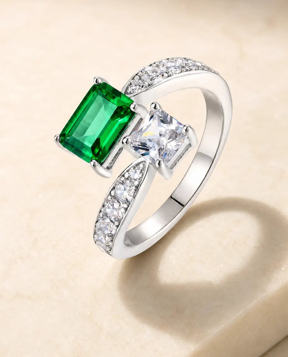 lab-created emerald and white cz toi-et-moi bypass ring in sterling silver, adjustable