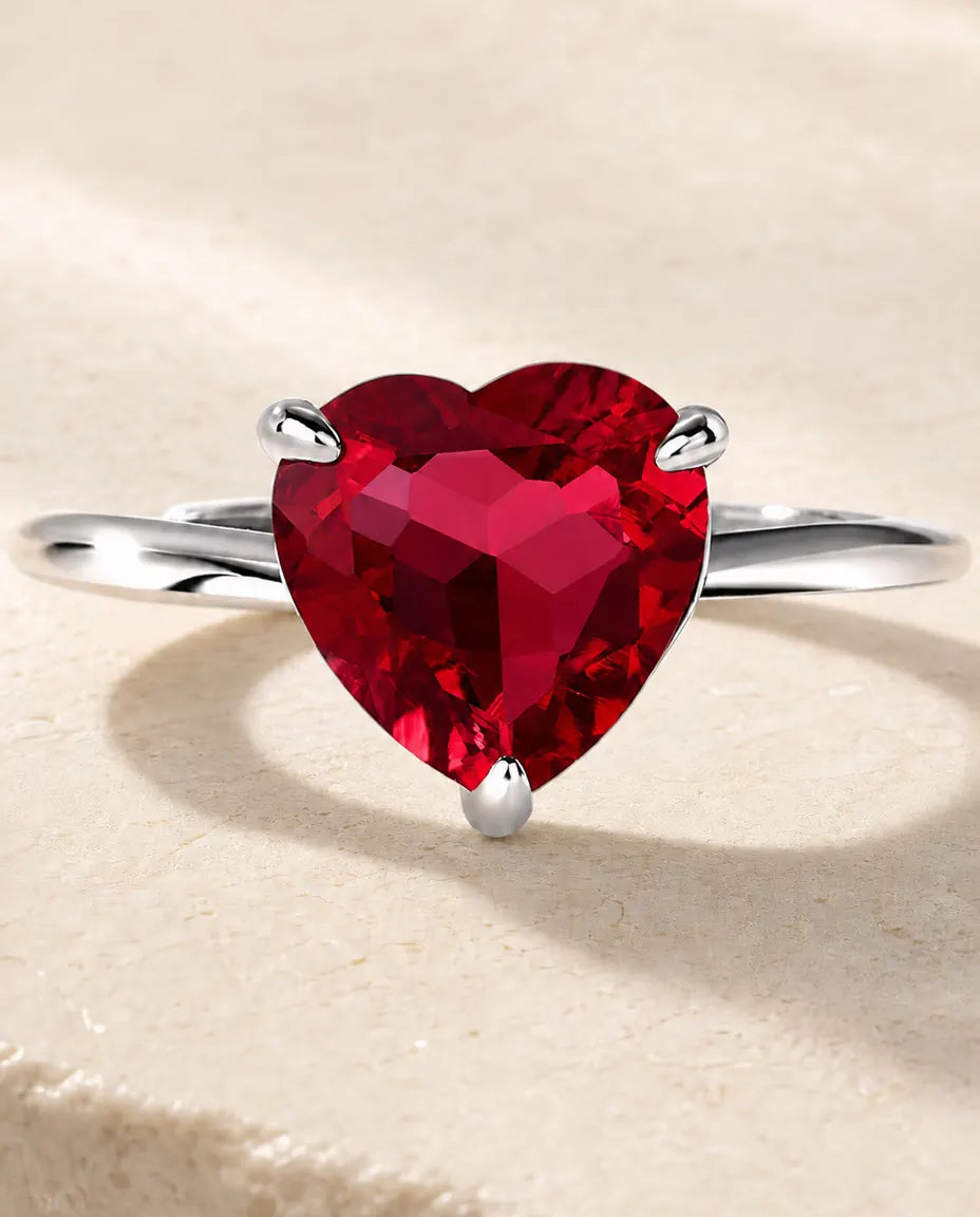 lab-created ruby heart solitaire ring in sterling silver, open adjustable band