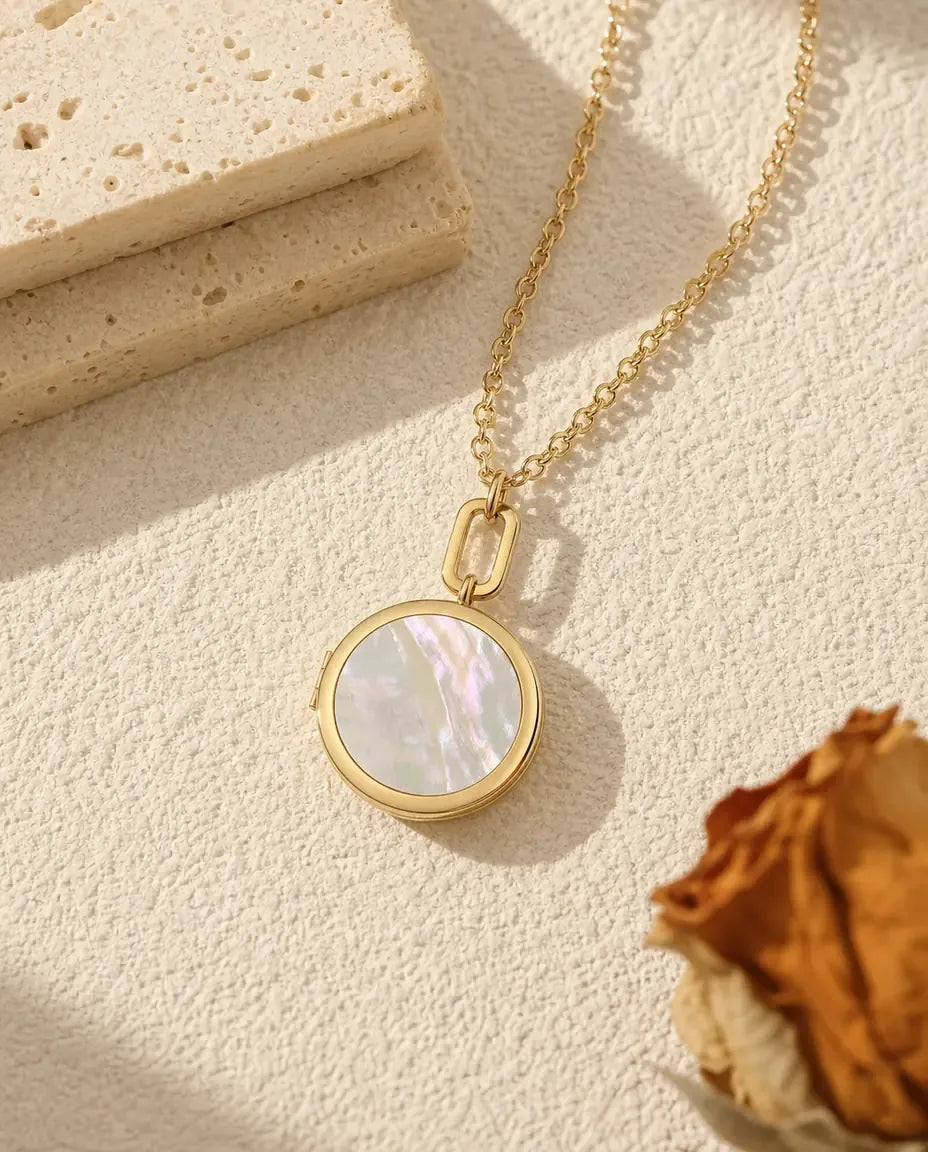 Gold round mother of pearl photo locket necklace on a paperclip link