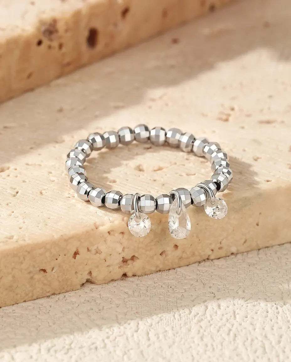 Dangle moissanite ring with three swinging stones on adjustable beaded silver band