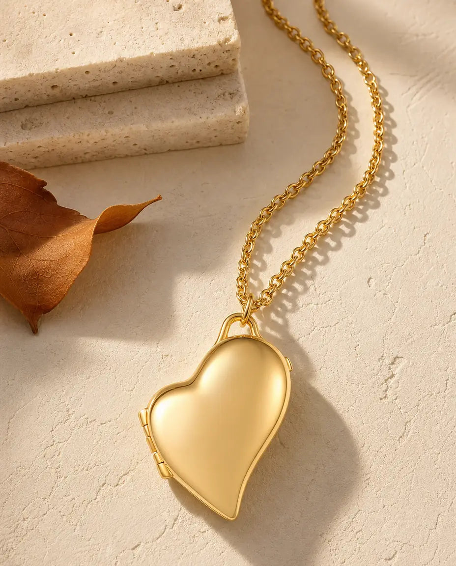 Personalized asymmetric heart photo locket necklace holding two pictures, silver and gold