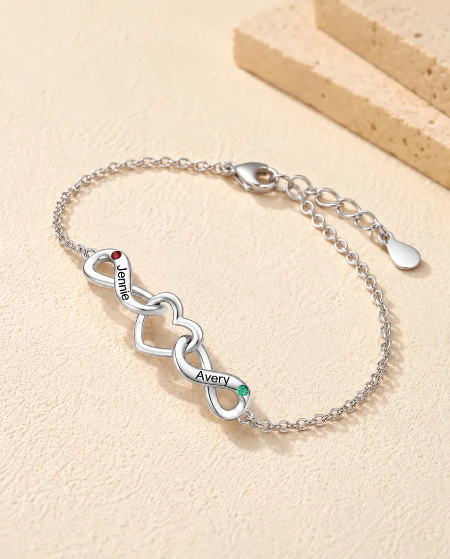 Personalized Infinity Bracelet With 2 Names - Double Infinity and Heart With Two Simulated Birthstones - three-quarter view