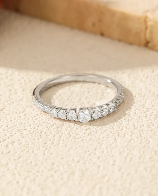 Graduated moissanite wedding band in 925 sterling silver with 19 round D color stones