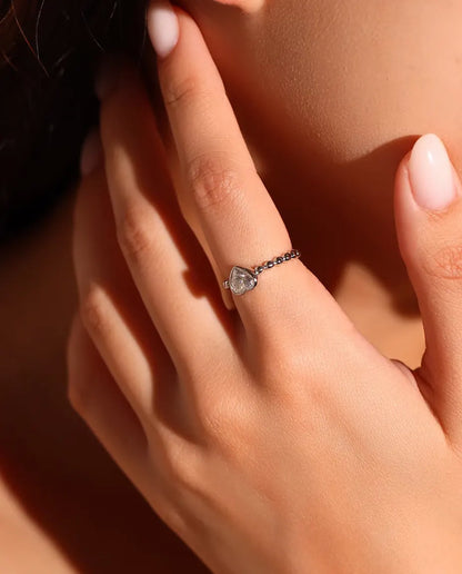 Heart Moissanite Ring in 925 Sterling Silver - worn on a model with her hands near her face