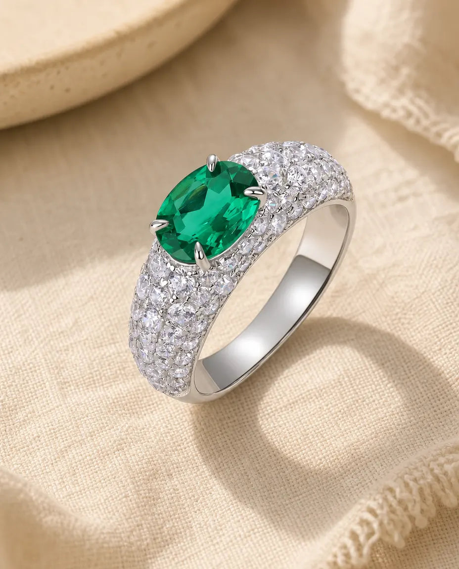 Lab emerald east west oval pave statement ring in sterling silver with domed band