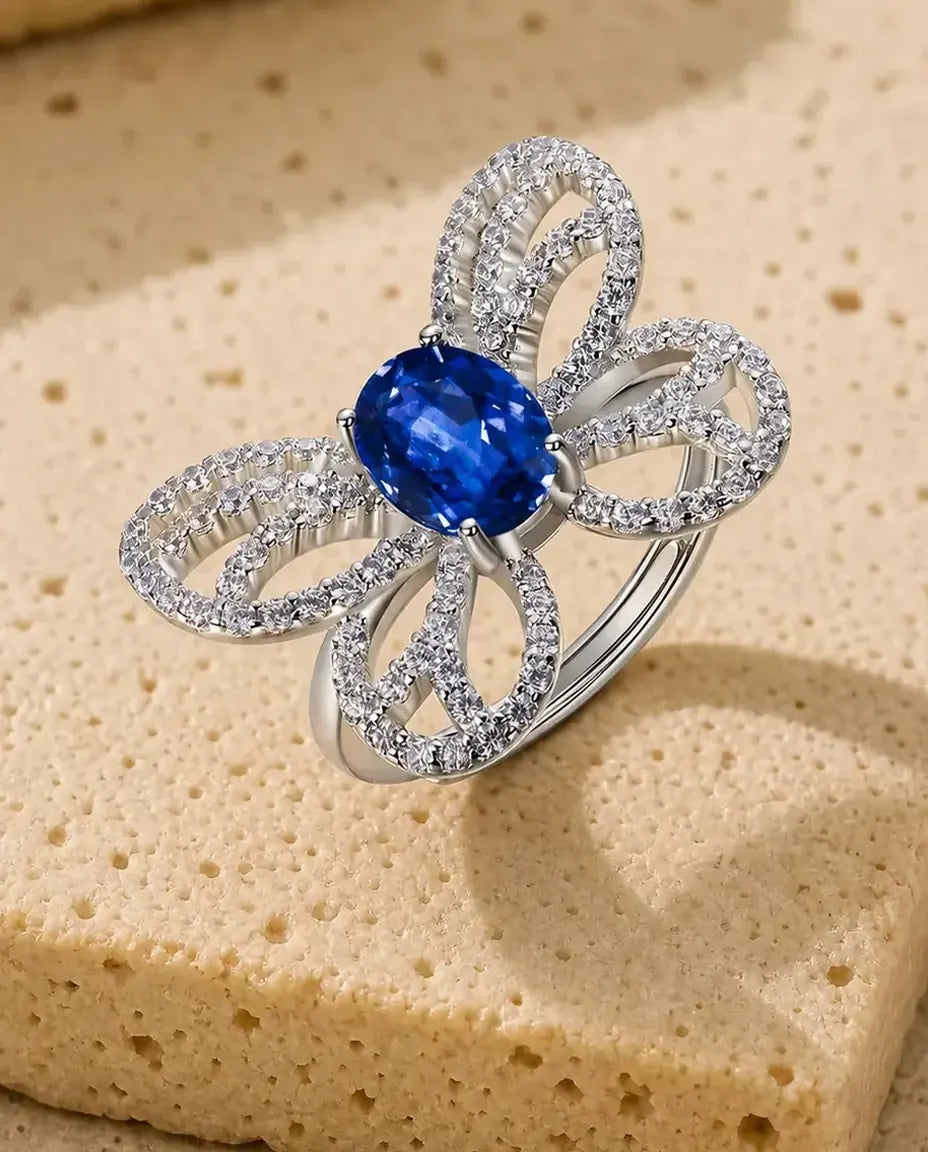 Lab sapphire butterfly statement ring in sterling silver with open pave wings