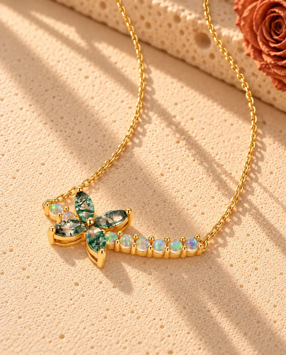 Moss Agate Flower Necklace in Gold Plated 925 Sterling Silver - seen at an angle on a cream textured surface