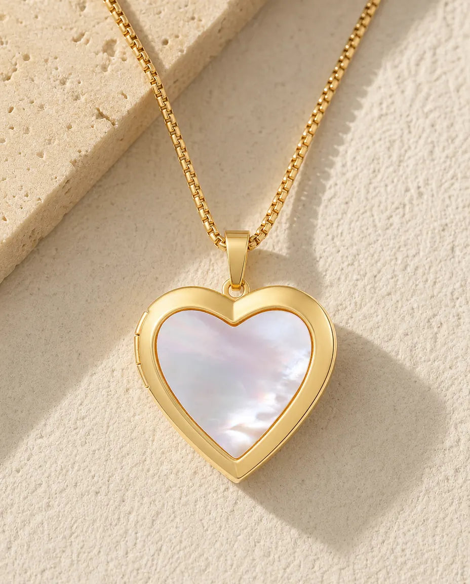 Gold heart photo locket necklace faced with one piece of white mother of pearl