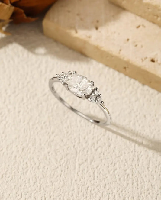 Oval Moissanite Engagement Ring - 1 Carat D Color VVS Solitaire in 925 Sterling Silver, Zirconia Side Clusters, Sizes 5-9