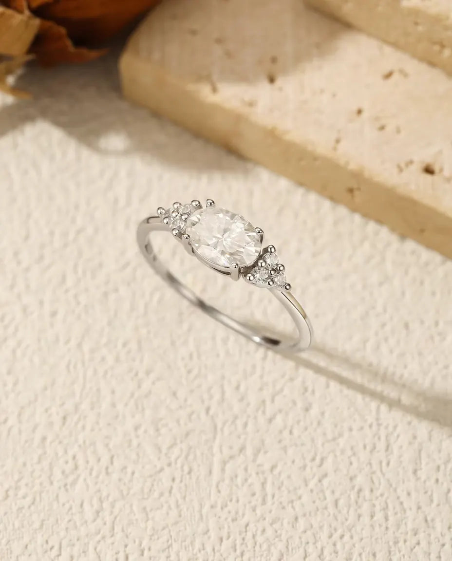 Oval Moissanite Engagement Ring - 1 Carat D Color VVS Solitaire in 925 Sterling Silver, Zirconia Side Clusters, Sizes 5-9
