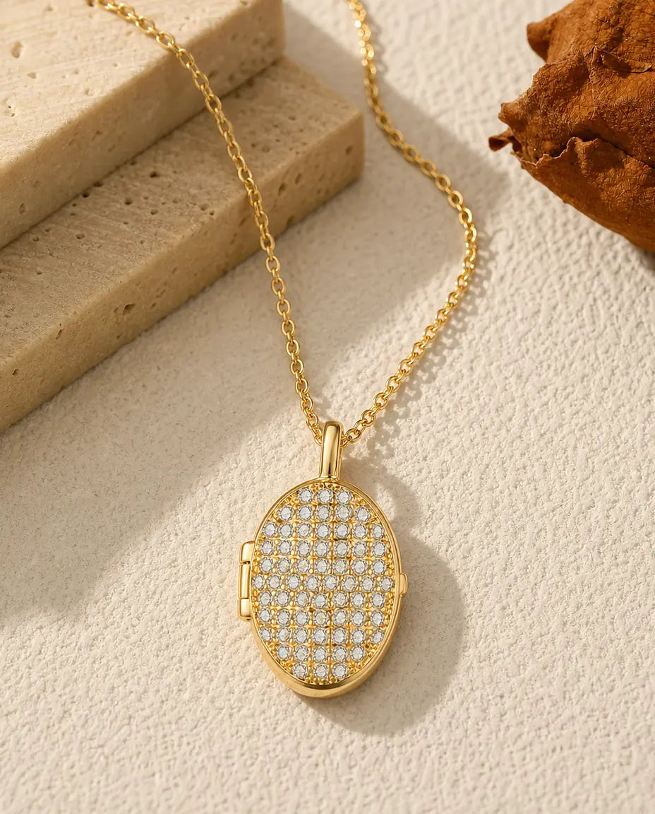 Personalized pave crystal oval photo locket necklace holding two pictures, gold