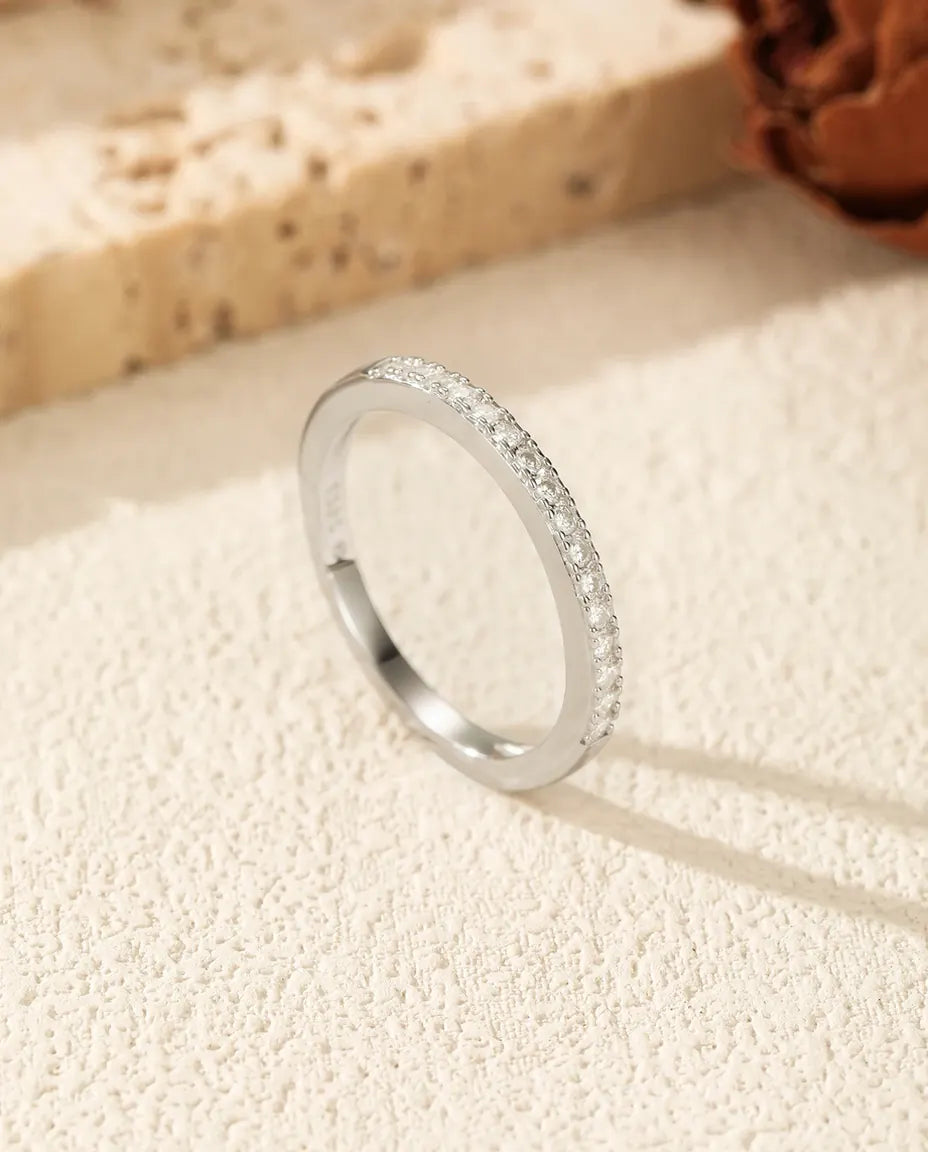 Pavé moissanite wedding band in 925 sterling silver with round D color stones