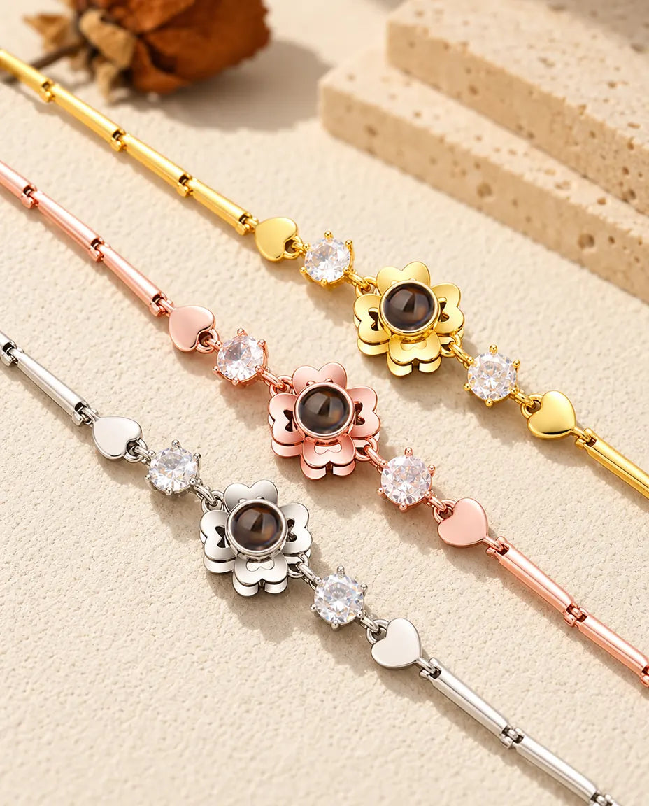 Close-up of three clover flower charms with heart petals in each color