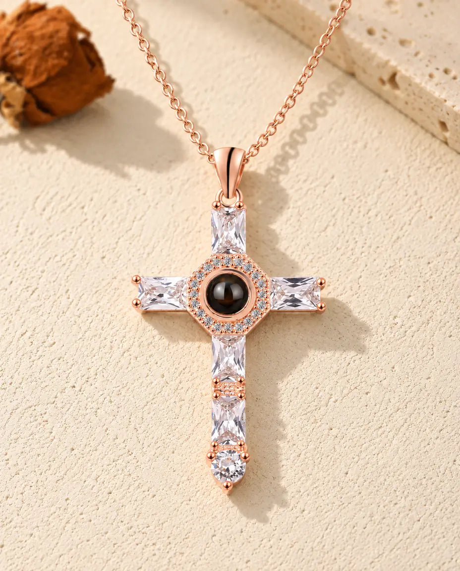 Front view of the rose gold tone cross with baguette cubic zirconia arms