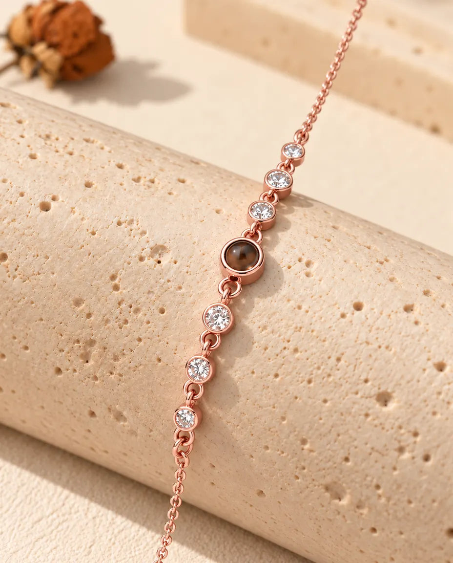 Close-up of the rose gold tone stone row draped over a travertine block
