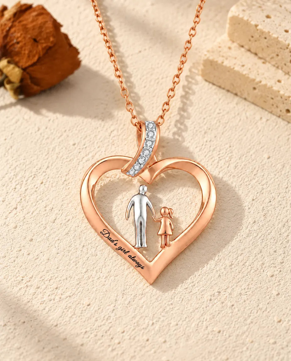 Front view of the engraved heart necklace with a silver-tone dad and a rose gold-tone girl holding hands