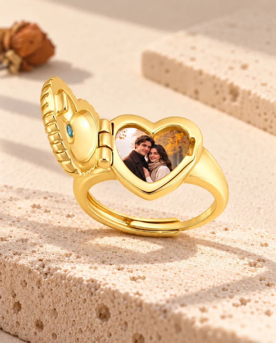Open heart photo locket ring from the side, showing the hinge and the photo