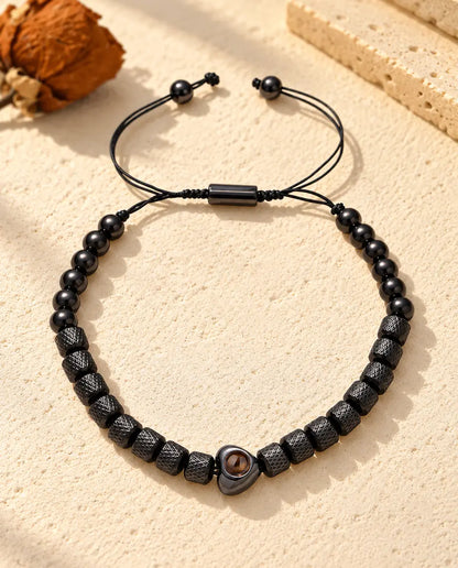 Black unisex heart projection bracelet with knurled barrel beads and round beads