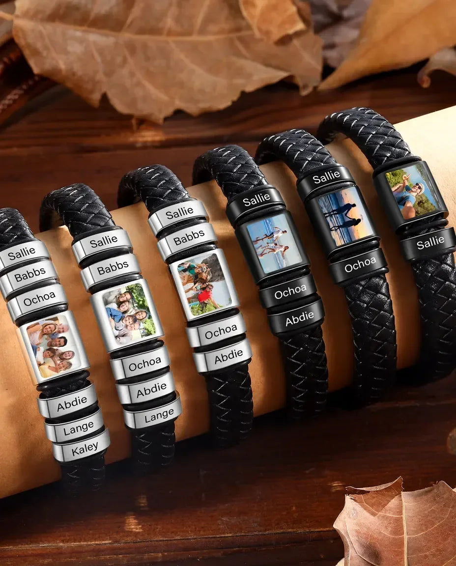 Stack of black braided leather photo bracelets with engraved name beads