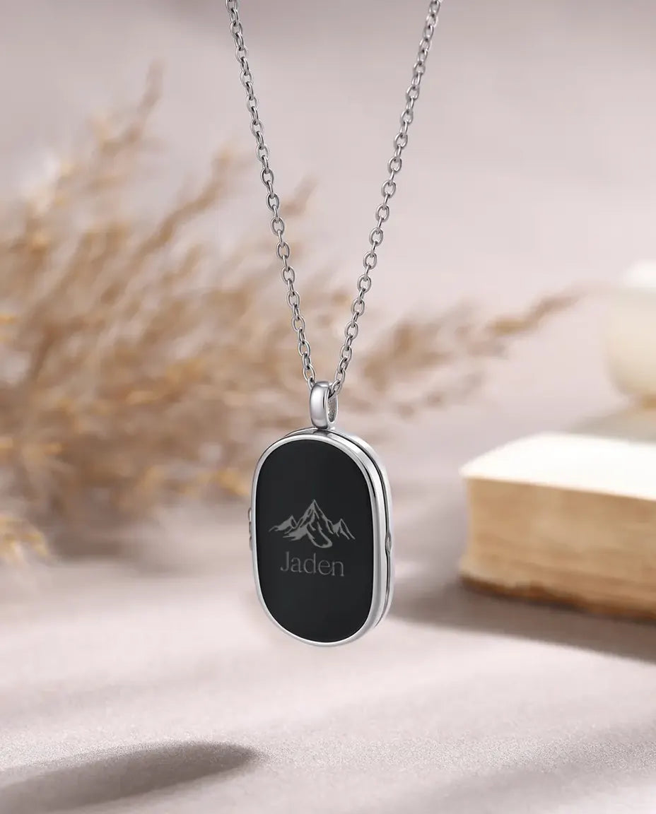 Personalized men's photo locket necklace with engraved mountain and name Jaden, black oval pendant on silver chain