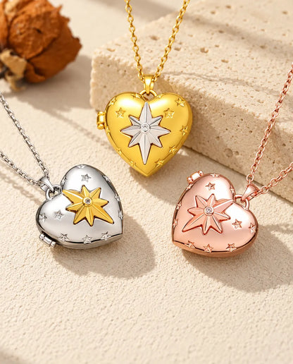 Three colors of the north star heart photo locket necklace arranged on plaster