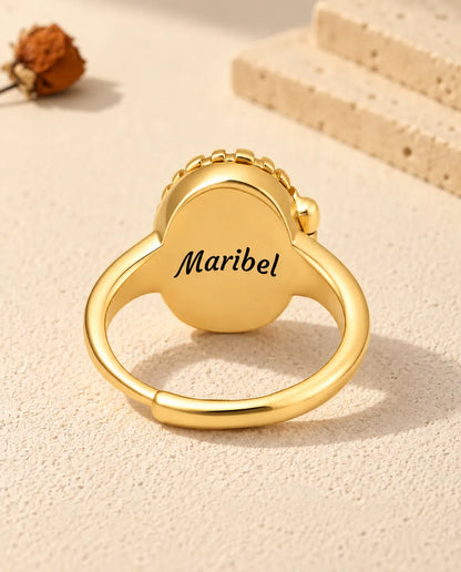 Back of the oval locket ring engraved with the name Maribel