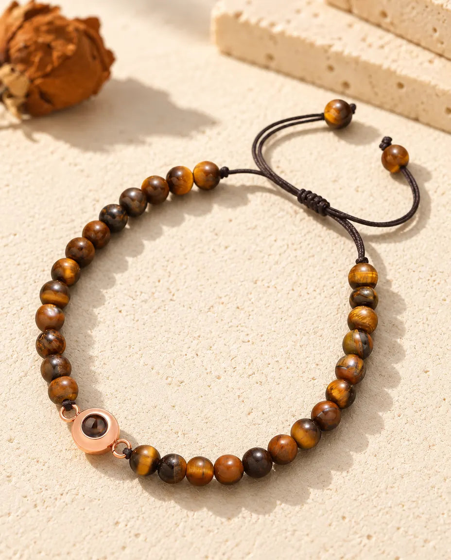 Tiger's eye bead bracelet with a rose gold tone photo projection ring charm