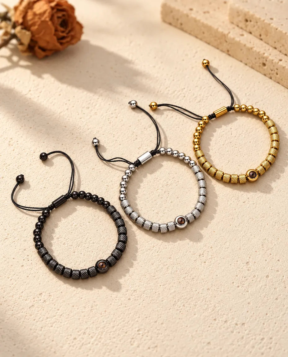 Three textured bead projection bracelets in gold tone, silver tone and black side by side
