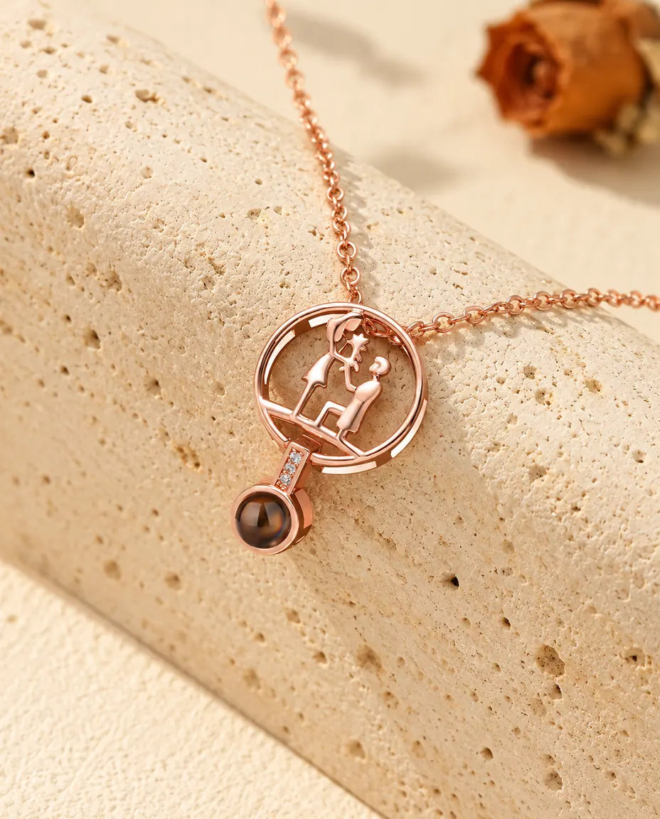 Rose gold tone proposal pendant with the projection stone at the end of a cubic zirconia bar