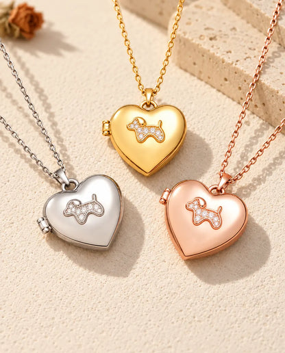 Three colors of the puppy heart photo locket necklace arranged on plaster