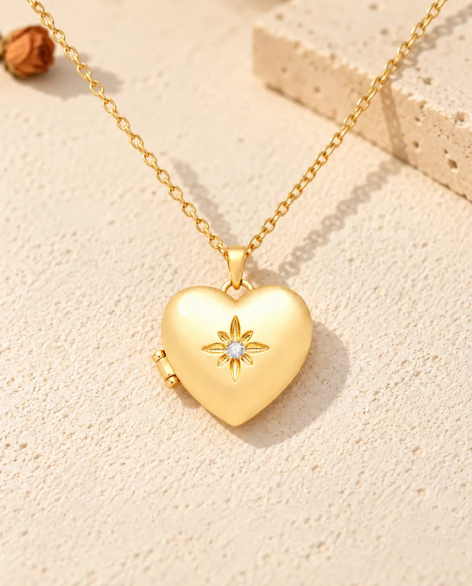 Front view of the gold tone satin flower heart photo locket showing the lid design and side hinge