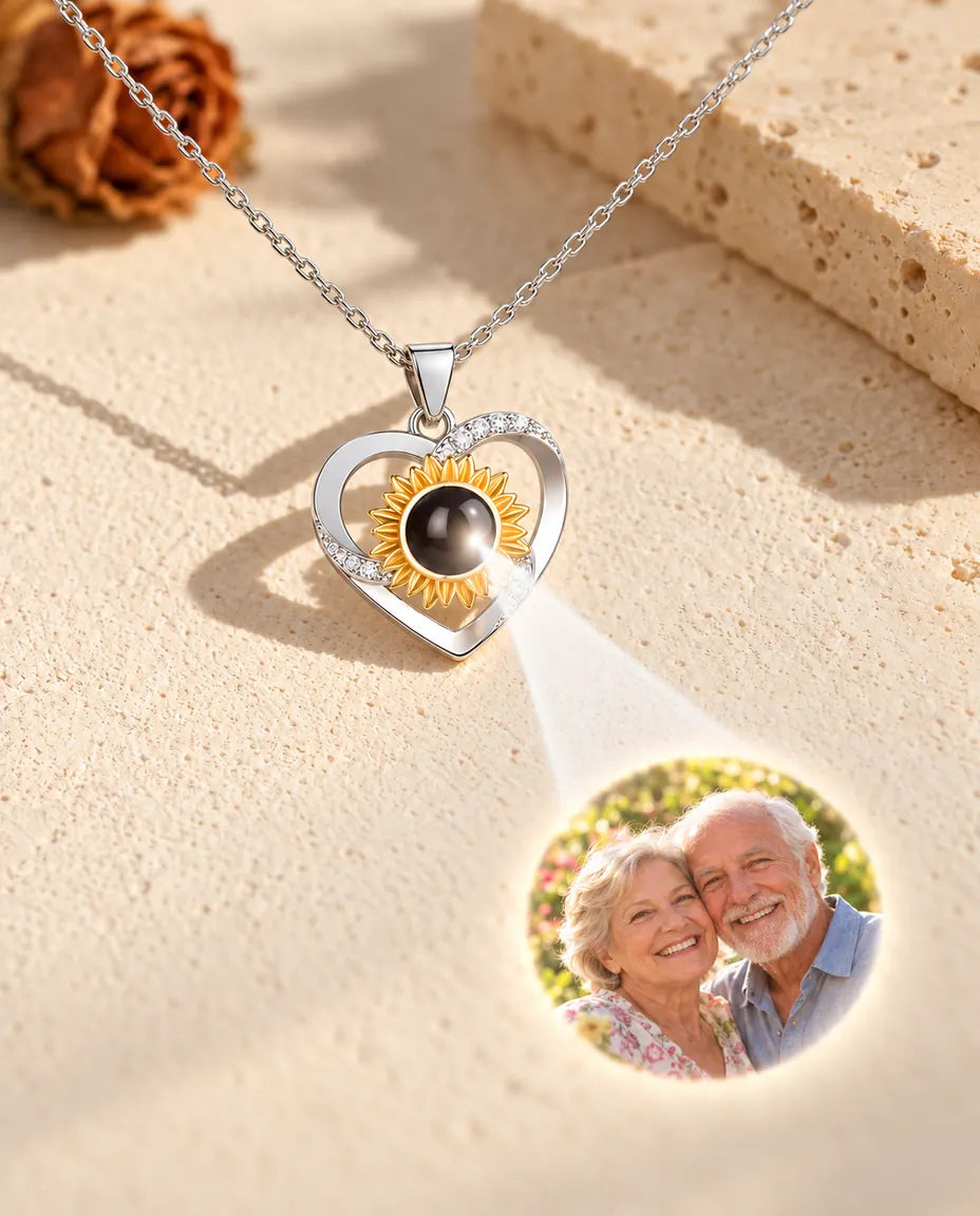Sunflower heart necklace projecting a grandparents photo onto cream plaster