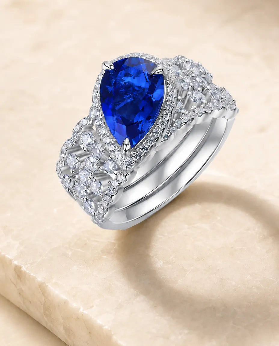 lab-created sapphire pear-cut 2-piece halo bridal set ring in sterling silver