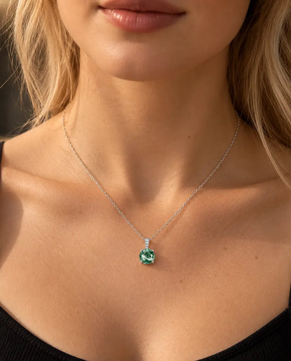 Round Moss Agate Solitaire Necklace in 925 Sterling Silver - worn on a model, close-up at the collarbone